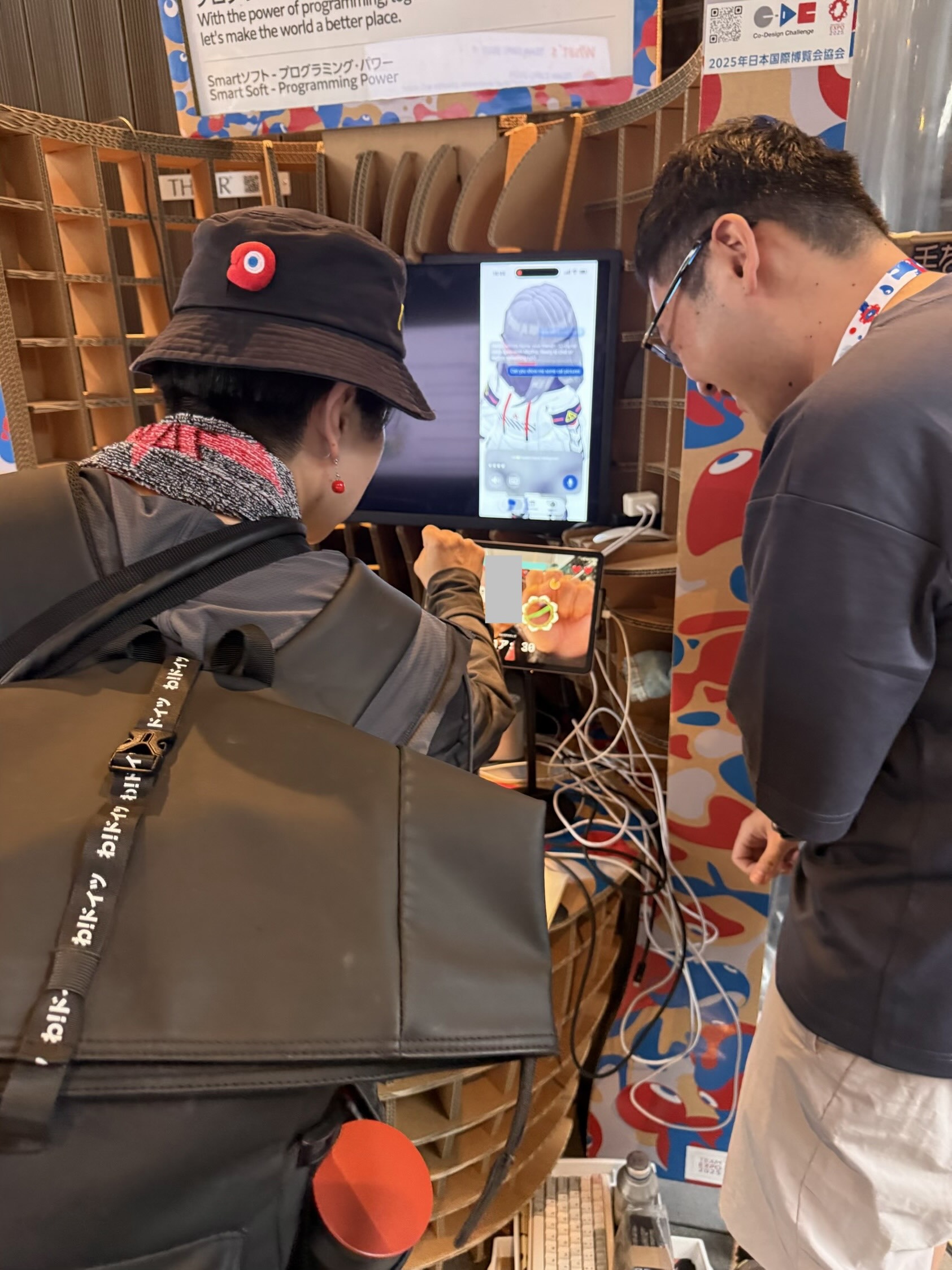 Visitor interacting with the AsterKit AR game at World Expo