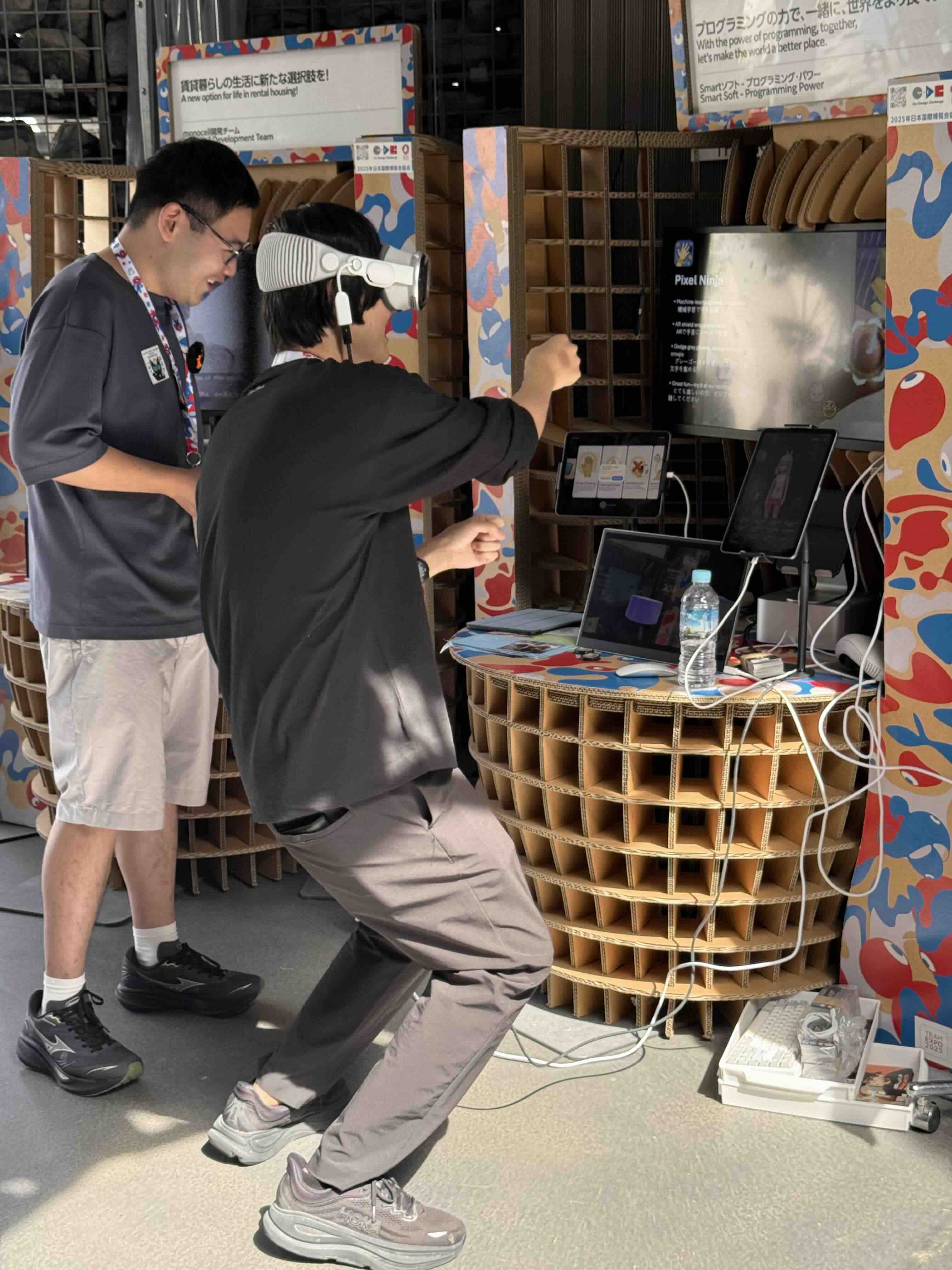 Visitor playing the Vision Pro game at the Expo booth